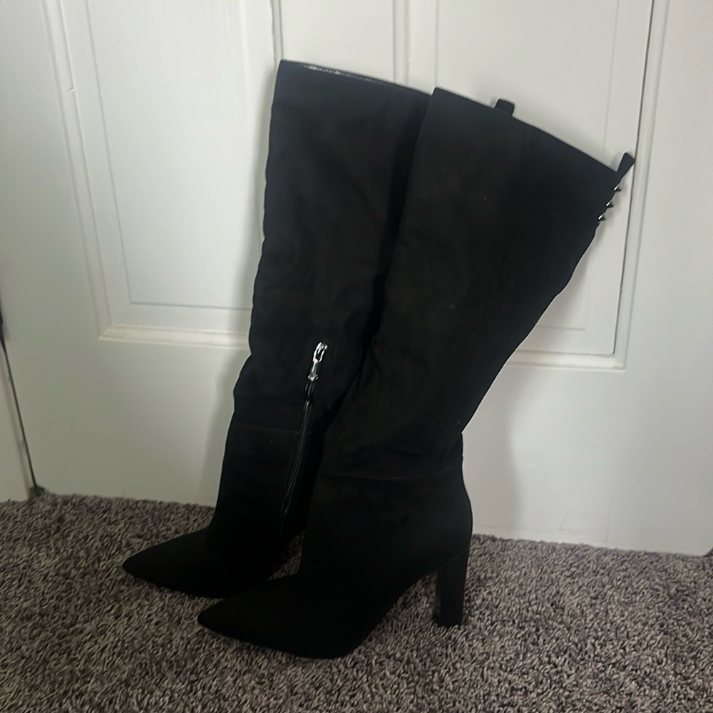 Pointy knee high, heeled black boots